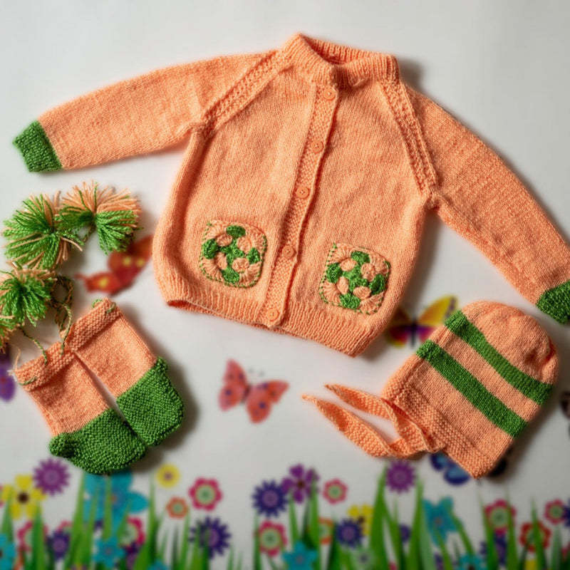 Peach Handknitted Woollen Set for infants. The set includes a unisex sweater, cap and booties.  - thesaffronsaga